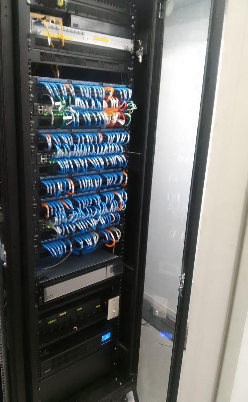 A floor-standing cabinet with dense, neat blue patching